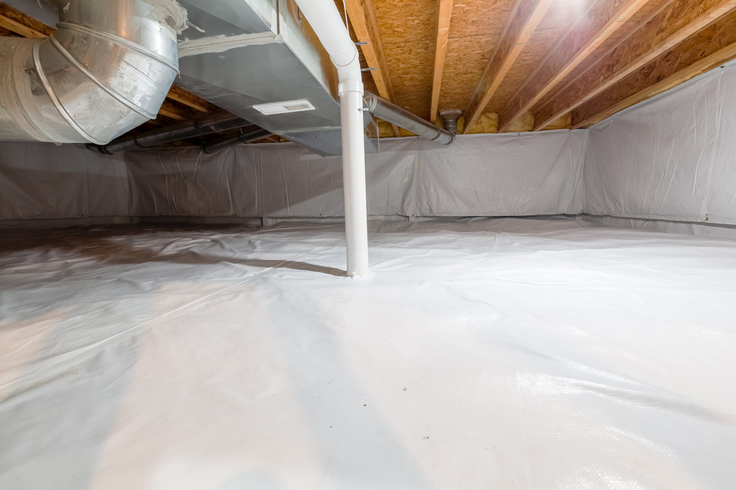 Basement crawl space with vapor barrier and ductwork, Michigan Smart Energy home energy upgrade.