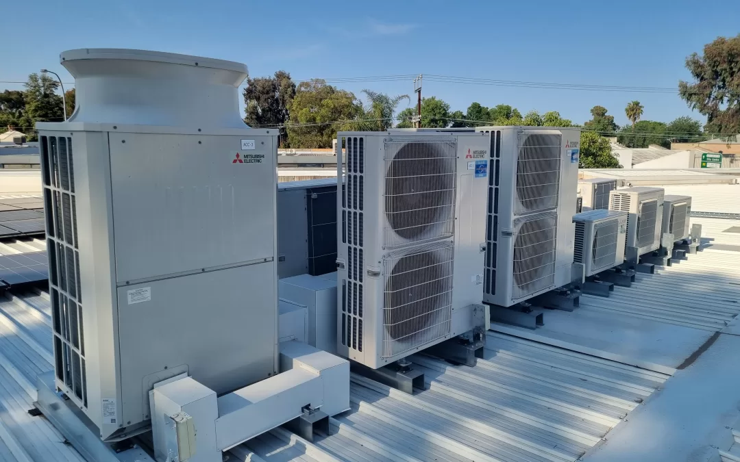 High-efficiency Mitsubishi furnaces on a roof, Michigan Smart Energy installation.