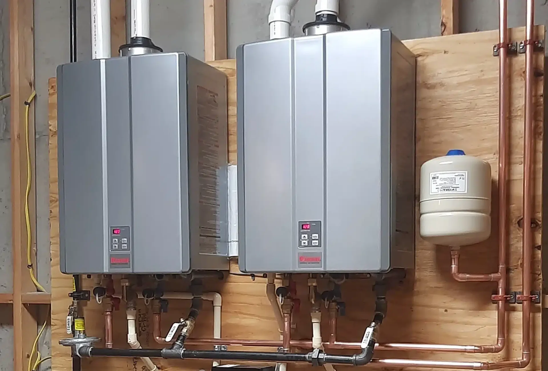 Tankless water heaters installed in a home, offering on-demand hot water and energy efficiency.